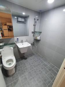 a bathroom with a toilet and a sink at Maru house Tranquil and Airy Space for Long or Short Stays in Nowon 2 qeen bed, near market, air-conditioner, Samsung TV in Seoul