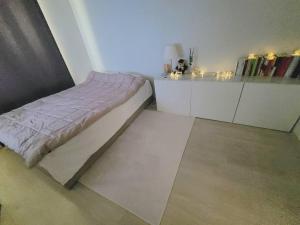 a small bedroom with a bed and white cabinets at Maru house Tranquil and Airy Space for Long or Short Stays in Nowon 2 qeen bed, near market, air-conditioner, Samsung TV in Seoul