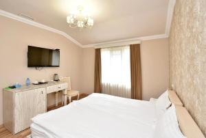 Postel nebo postele na pokoji v ubytování Homestay Hotel