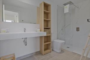 a bathroom with a sink and a shower and a toilet at ViVi Homes - Levalin Wellness, Pool & Terrace in Fuengirola +31 photos