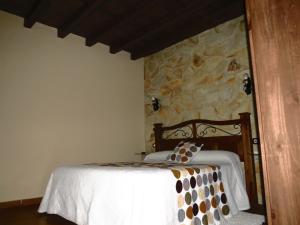 A bed or beds in a room at El Rincon Del Villar