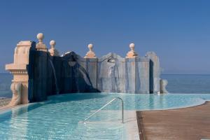 a swimming pool with a water slide at Grand Hotel Principe Di Piemonte in Viareggio