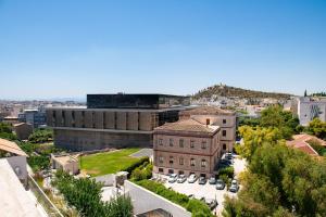 an aerial view of a building in a city at A stylish modern apartment on Makrygianni Str next to Areopagitou and the Acropolis Museum in Athens