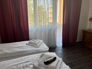 Posteľ alebo postele v izbe v ubytovaní Apartmány LAGUNA
