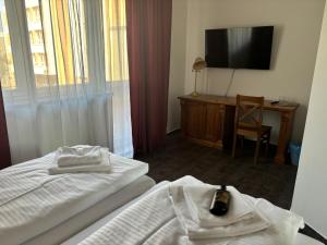 Posteľ alebo postele v izbe v ubytovaní Apartmány LAGUNA