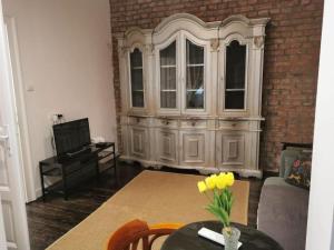 a living room with a large hutch and a table at Golden Age Hollywood PROMO PRICE! in Vračar (historical)