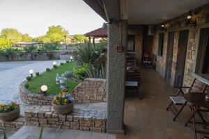 Patio nebo venkovní prostory v ubytování Kallinikos Guesthouse