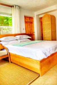 Postel nebo postele na pokoji v ubytování Blue Whale Villa - Deluxe