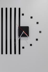 a black and white clock with black keys at Modern Apartment With Private Garden Międzywodzie by Renters Prestige in Międzywodzie