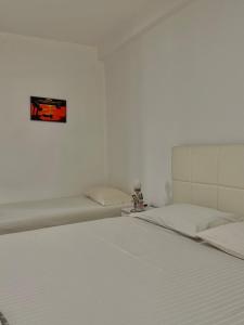 Ένα ή περισσότερα κρεβάτια σε δωμάτιο στο Grand House Apartment