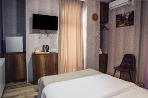 Voodi või voodid majutusasutuse Legend Hotel toas