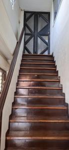 a set of wooden stairs in a building at Lowest Price Room In Chinatown Davao with WiFi Room 1 in Davao City
