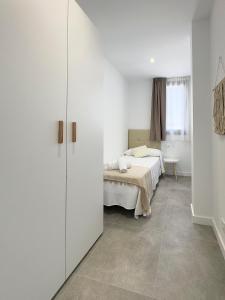 Postel nebo postele na pokoji v ubytování Apartamentos Clotilde