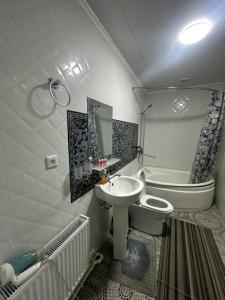 a bathroom with a sink and a toilet at Dolon B&B Hotel in Bukhara +75 photos