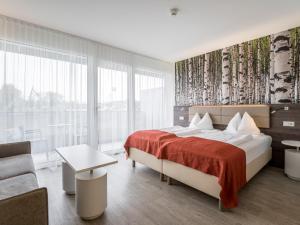 Posteľ alebo postele v izbe v ubytovaní Eco Suite Hotel