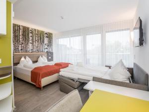 Posteľ alebo postele v izbe v ubytovaní Eco Suite Hotel