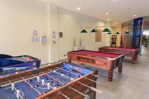 two pool tables in a room with at R2 Hotel Pajara Beach in Costa Calma