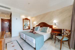 a hotel room with a bed and a desk at R2 Rio Calma in Costa Calma