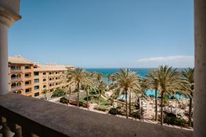 a view of the beach from the balcony of a resort at R2 Rio Calma in Costa Calma