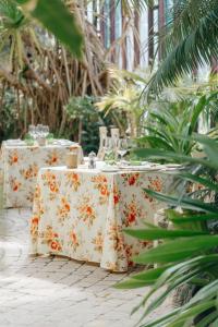 a table with a white table cloth with glasses on it at R2 Rio Calma in Costa Calma