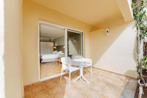Postel nebo postele na pokoji v ubytování R2 Buganvilla Hotel & Spa