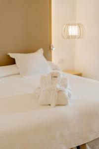 Postel nebo postele na pokoji v ubytování R2 Buganvilla Hotel & Spa