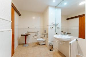 a bathroom with a toilet and a sink at R2 Rio Calma in Costa Calma