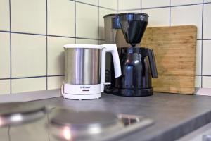 Příslušenství pro přípravu čaje a kávy v ubytování Haus Rebberg