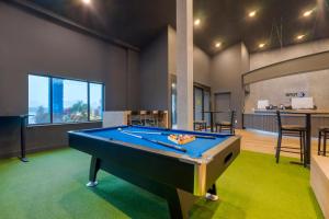 a billiard room with a pool table in it at Spot X Hotel Wesley Chapel - Tampa Area in Wesley Chapel