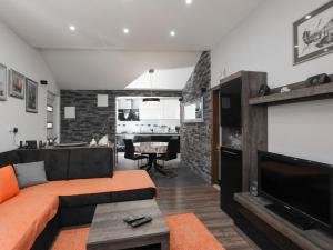 a living room with a couch and a flat screen tv at Apartment Tonka - Two Bedroom Apartment - ST in Supetar