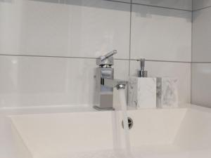 a bathroom with a sink with a faucet at Apartment Tonka - Two Bedroom Apartment - ST in Supetar +31 photos