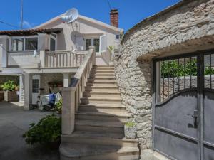 a stone stairway leading to a house with a door at Apartment Tonka - Two Bedroom Apartment - ST in Supetar