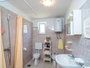 a bathroom with a sink and a toilet and a shower at Apartment Laurel Leaf - Three Bedroom Apartment with Terrace in Gruda +42 photos