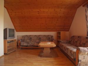 a living room with two couches and a coffee table at Guesthouse afran- Two Bedroom Apartment in Plitvička Jezera