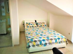 a bedroom with a bed in a room at Apartments Milic - Studio Apartment with Sea View 4 - 2 in Gornji Karin