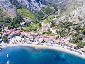 an aerial view of a beach with a resort at Apartments Seafront Silence - Studio Apartment with Terrace and Sea View in Trstenik