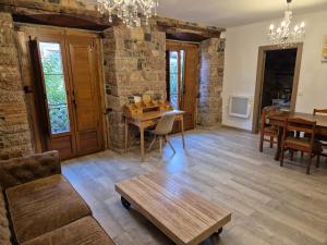 a living room with a table and a couch at Pensión San Pelayo 10 in Cangas de Onís