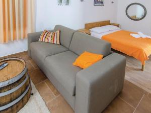 a living room with a couch and a bed at Holiday Home Stari Zoganj - Two Bedroom Holiday Home with Terrace and Swimming Pool in Potomje +46 photos