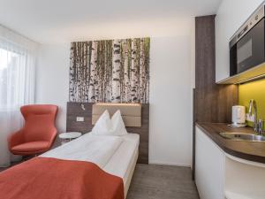 Posteľ alebo postele v izbe v ubytovaní Eco Suite Hotel