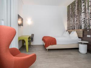 Posteľ alebo postele v izbe v ubytovaní Eco Suite Hotel