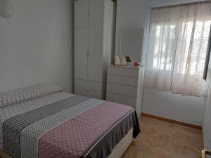 Ένα ή περισσότερα κρεβάτια σε δωμάτιο στο Mi casita en Tias