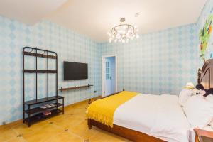 Postel nebo postele na pokoji v ubytování Hanju Guesthouse - Near Disney Park