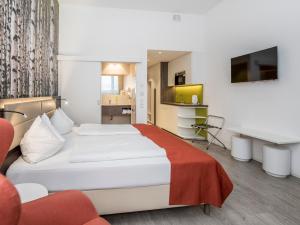 Posteľ alebo postele v izbe v ubytovaní Eco Suite Hotel