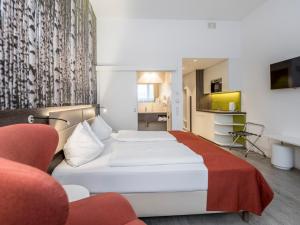 Posteľ alebo postele v izbe v ubytovaní Eco Suite Hotel