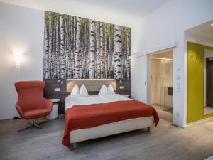 Posteľ alebo postele v izbe v ubytovaní Eco Suite Hotel