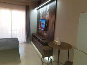 A television and/or entertainment centre at Florenza khamsin aprt F7