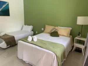 Katil atau katil-katil dalam bilik di Pousada Reserva de Itaúna
