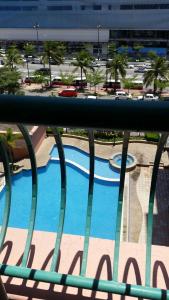 a view of a swimming pool from a balcony at T & H Vacation Condo @Marina Court in Kota Kinabalu