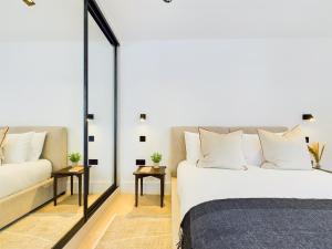 a bedroom with a bed and a couch at Be London - Maida Vale Residences in London