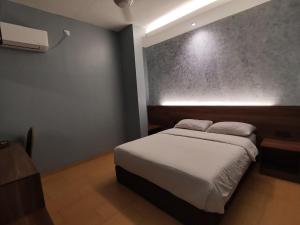 Voodi või voodid majutusasutuse Lumut Hotel toas